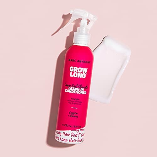 Marc Anthony Grow Long Leave-In Conditioner bottle on pink background